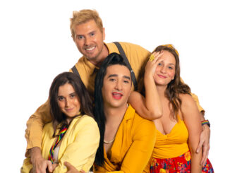 Four people dressed in yellow cuddling